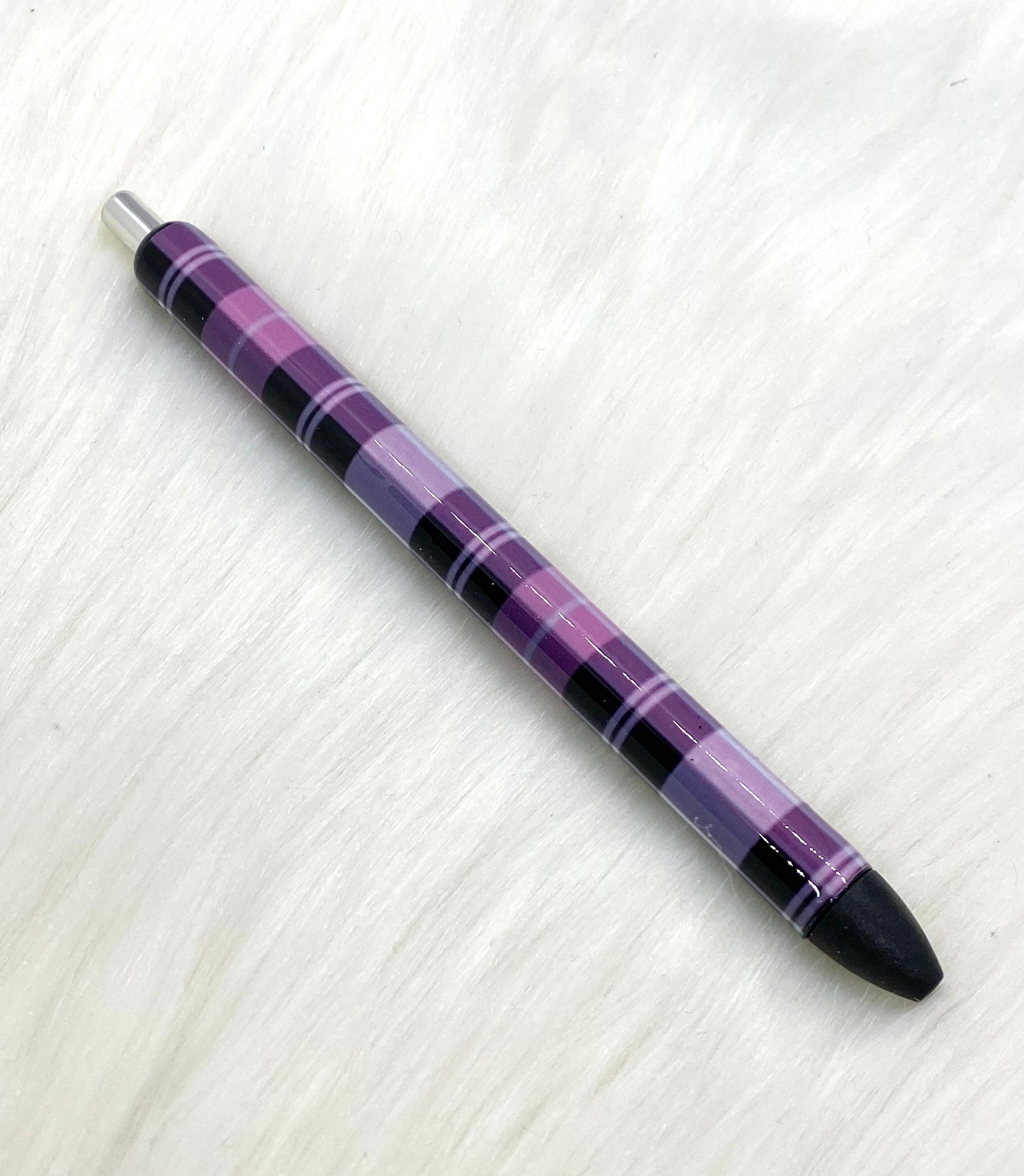 Pink and black plaid pen